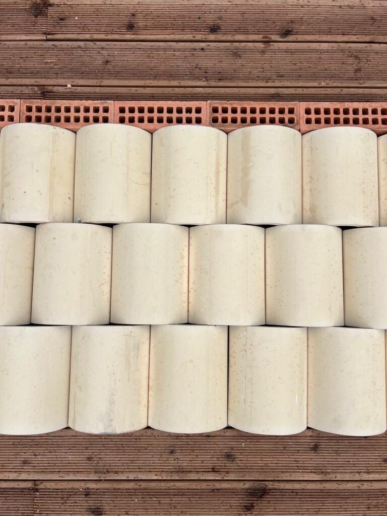 Material study: half-round ceramic units and perforated red brick